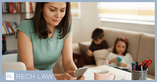 mom in front of kids on phone