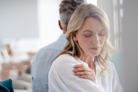 Wife sad turned away from her husband