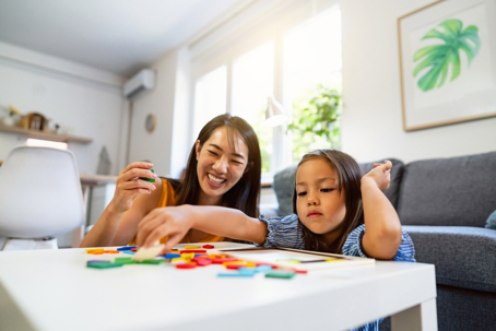 mother and daughter playing with puzzles